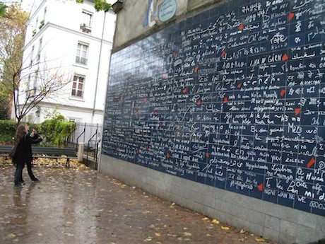 Lovers in Paris: The I Love You Wall in the Montmartre neighborhood of Paris. The wall is composed of 612 tiles with the words “I love you” written 311 times in 250 different languages.