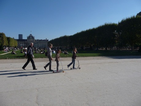 Scooter riding at the kid-friendly Champ de Mars, part of local Paris that can be found in the shadow of the Eiffel Tower