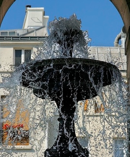 Water gushing from the Fontaine des Innocents in Paris